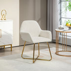 Cream upholstered accent chair with channel tufted back, curved arms, and gold metal base