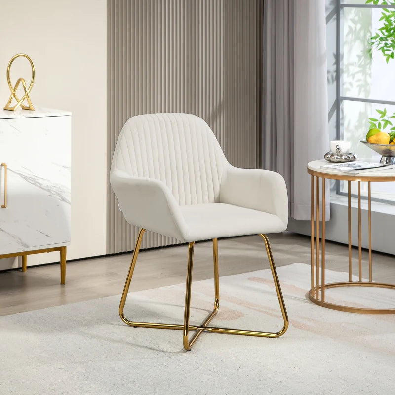 Cream upholstered accent chair with channel tufted back, curved arms, and gold metal base