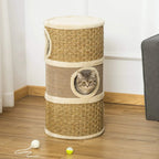 Khaki cat scratching barrel tower with plush top and a cat in the side doorway