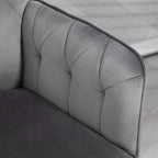 Dark grey upholstered chair backrest with tufted stitching and curved arm detail