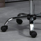 Chrome swivel base with black caster wheels for a beige office chair