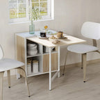 Oak and white drop-leaf dining table with open cube storage and two side chairs