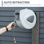 White retractable air hose reel with grey hose being pulled out from the side inlet