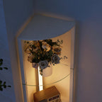 White LED floor lamp with corner glass shelves and warm light, top-front angle