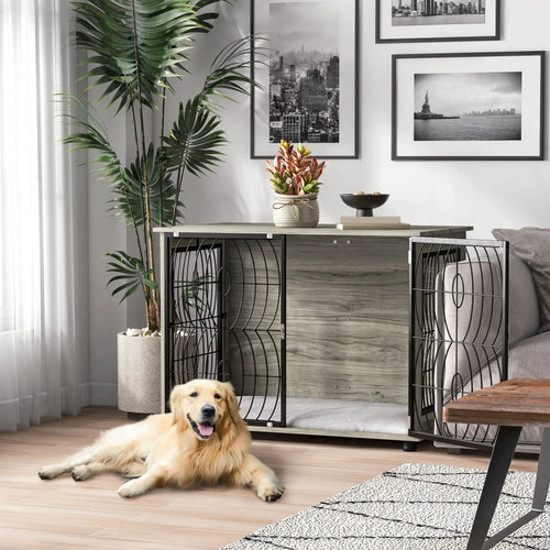 Grey dog crate end table with cushioned interior and front door, shown with resting dog