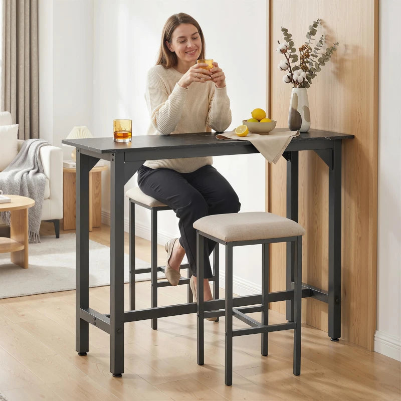 Black marble-effect bar table with sturdy metal frame and four tapered legs