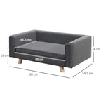 Grey dog sofa bed with cushion and armrests, wooden legs, angled product view