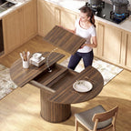 Dark walnut round dining table with extension boards pulled out from hidden leaf storage