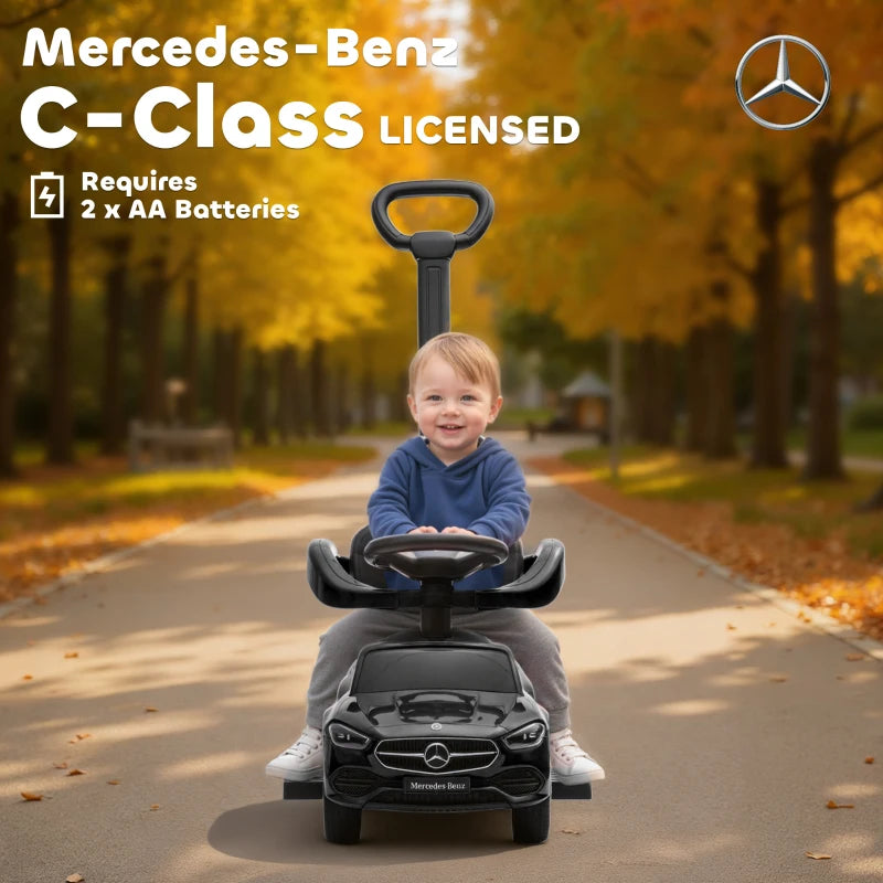 Black Mercedes-Benz C-Class licensed ride-on push car with child seated and handle
