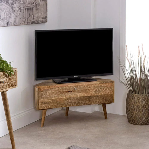 Light mango wood corner TV stand with patterned doors and open media shelf
