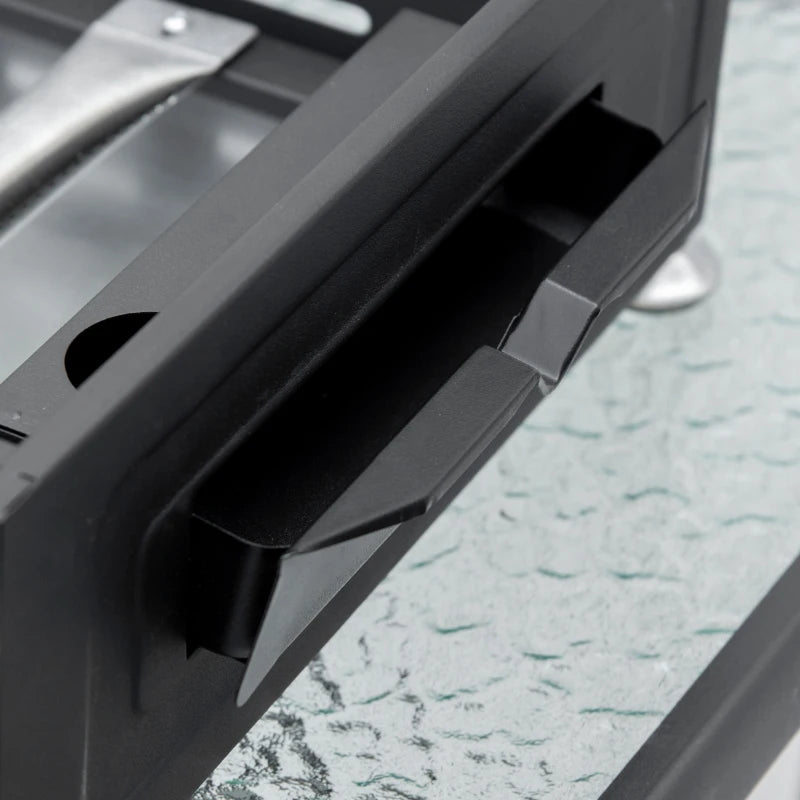 Black grease tray and griddle housing of a tabletop gas griddle grill