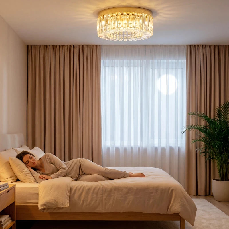 Gold-tone flush crystal chandelier with clear hanging prisms and warm glow