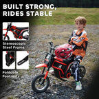 Red electric kids motorbike parked on gravel with rider and visible wheel and frame