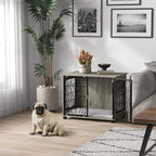 Indoor dog crate end table in grey with black wire door and plush cushion beside sofa