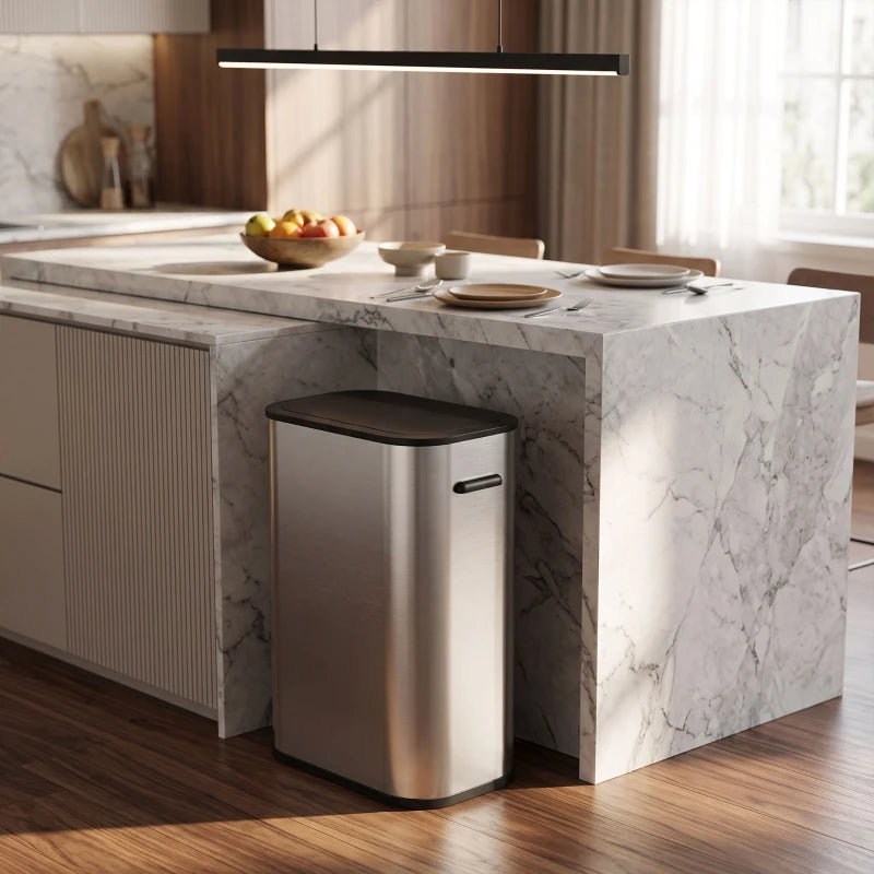 Stainless steel sensor waste bin placed under kitchen counter