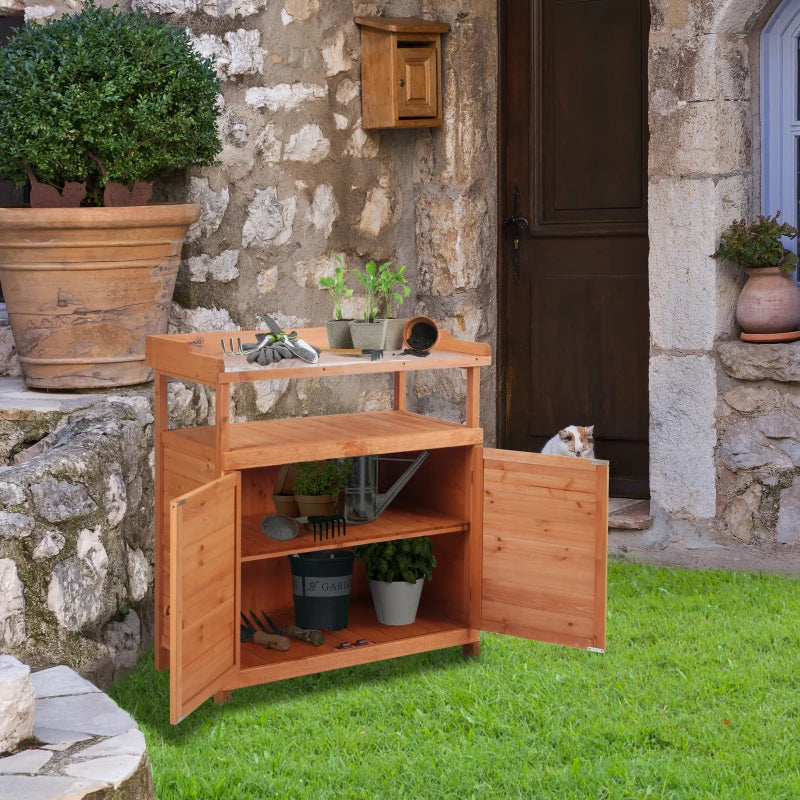 Orange wooden potting bench with open shelves, galvanized top, and storage cabinet