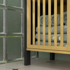 Under sink cabinet open front showing interior storage behind bamboo slatted door