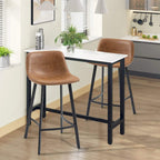 Brown upholstered bar stools with black frames, styled around a kitchen counter