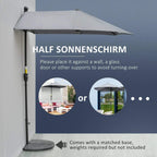 Dark grey half market umbrella against a wall, pole with crank control and top finial.