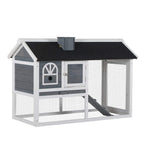 Grey wooden rabbit hutch and run with dark roof panel and ramp opening