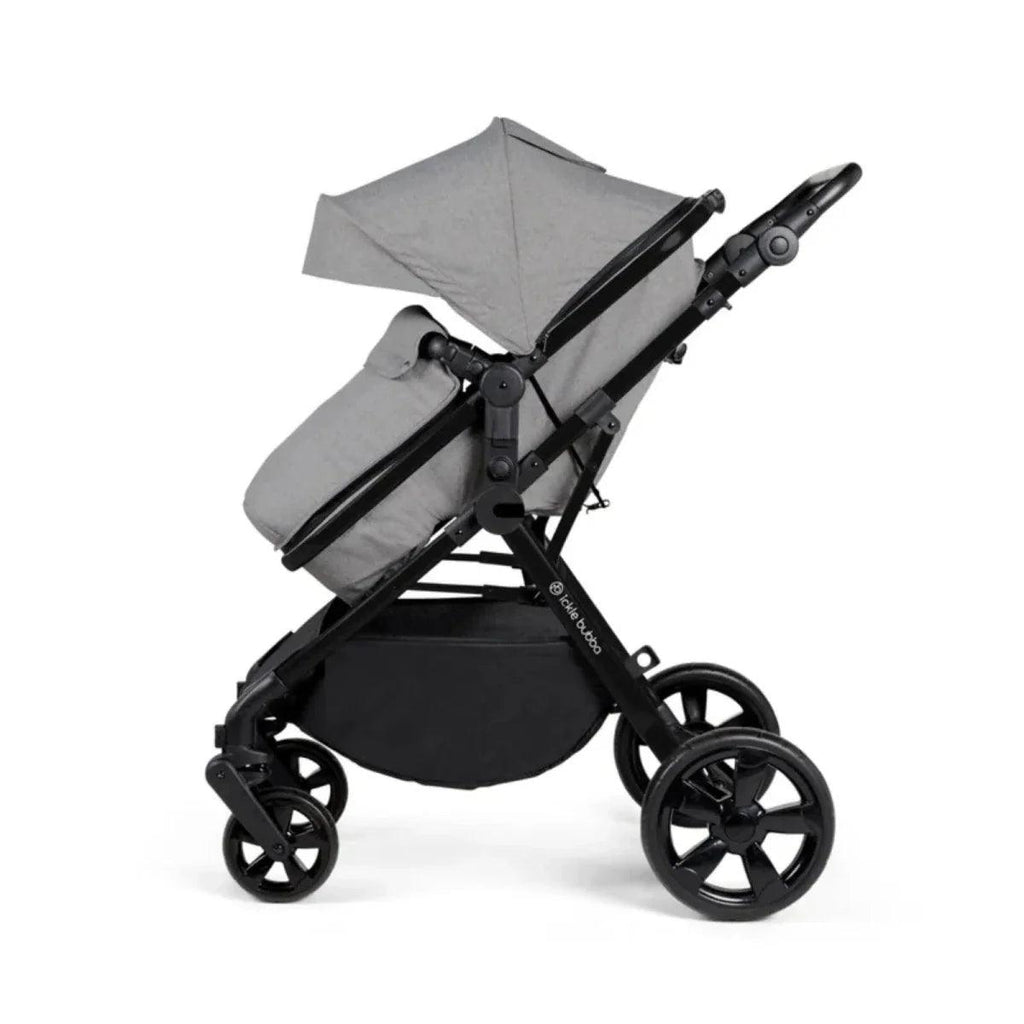 Space grey stroller side view with canopy and padded carry seat; black wheels and frame