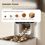 Automatic cat feeder outlet area with kibble falling into stainless feeding tray