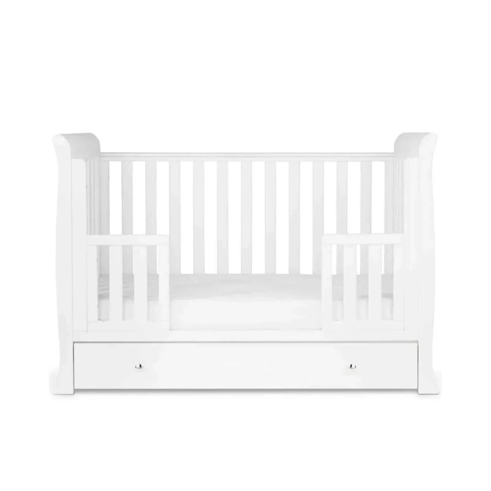 White wooden toddler bed with front drawer and vertical slatted sides, open frame