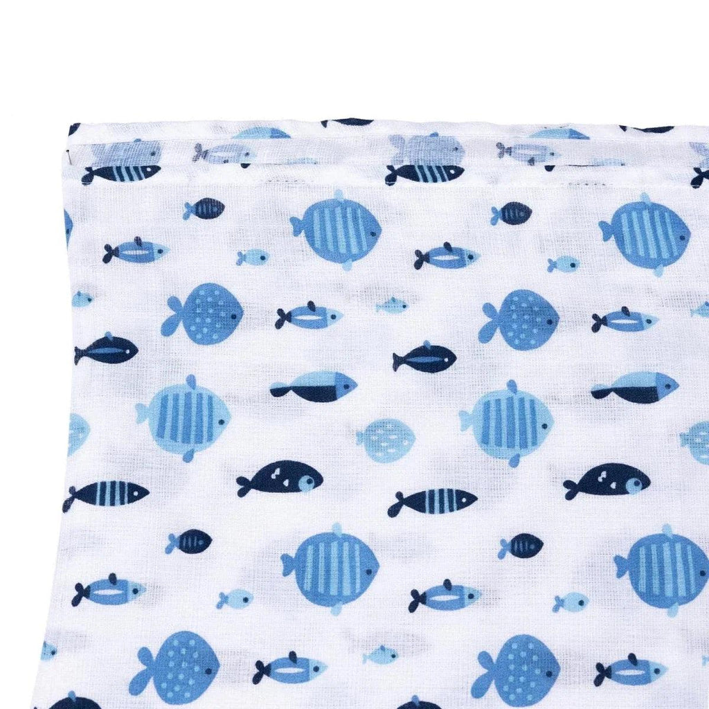Blue muslin baby blanket fabric face with scattered fish and sea turtle pattern