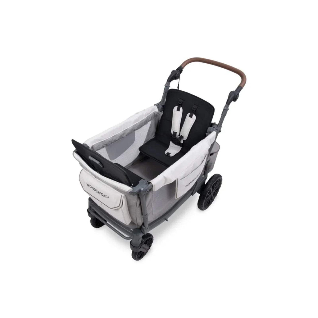 Grey stroller wagon with padded seat insert, dark harness, and brown handlebar.