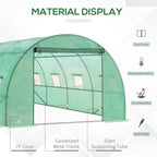 Green walk-in greenhouse front with mesh window panels and arched frame close-up
