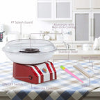 Red and white cotton candy machine on kitchen counter with clear dome and controls