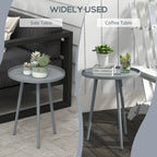 Grey round table with smooth edge, flat circular top, and tapered steel legs