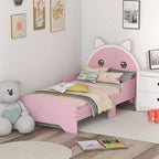 Pink toddler bed frame with cat headboard and guardrails, styled with bedding.