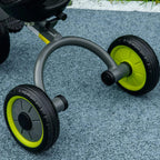 Close-up of kids tricycle frame and lime wheels with EVA tire tread