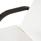 Close-up of dark brown woven rattan armrest and white cushion on a sun lounger