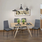 Set of four grey dining chairs with tall backs, linen-touch upholstery, and metal legs