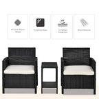 Black PE rattan armchairs with cream cushions and matching glass-top table