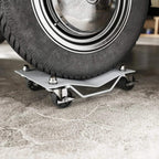 Swivel caster wheel dolly with non-slip metal plate supporting a car tire.