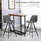 Set of 2 dark grey quilted bar stools with curved padded backs, steel legs, and footrests