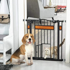 Black pet safety gate with cat flap and auto-close, installed in doorway with pets nearby