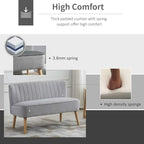 Light grey velvet two-seat sofa with thick padded seat and wooden legs