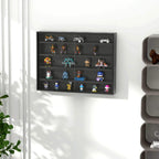 Black wall display cabinet with glass doors holding decorative figurines on multiple shelves