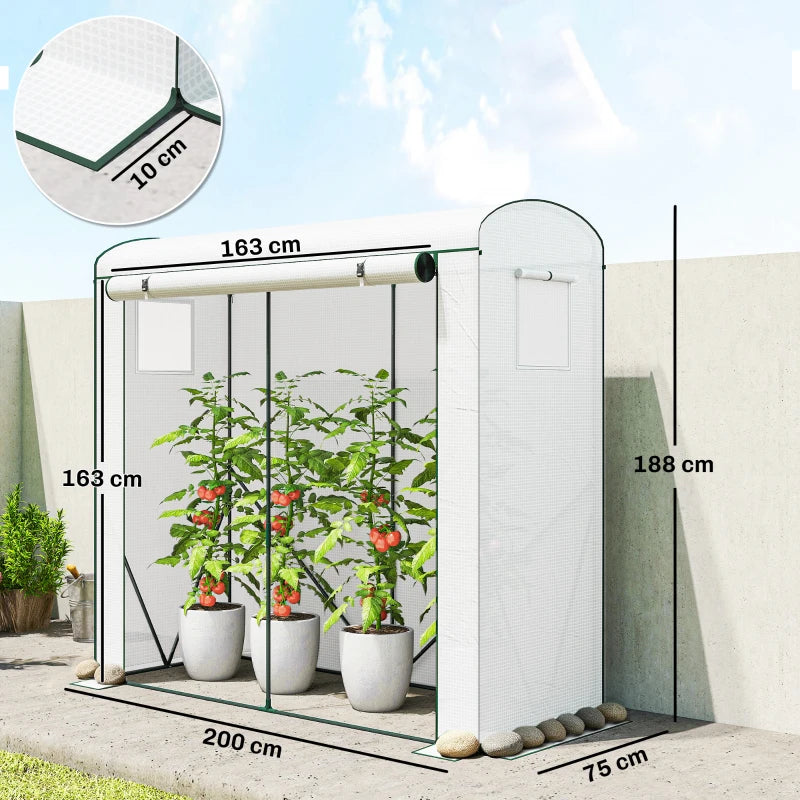 White mini greenhouse with mesh windows and indoor tomato plants in pots