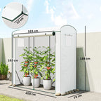 White mini greenhouse with mesh windows and indoor tomato plants in pots