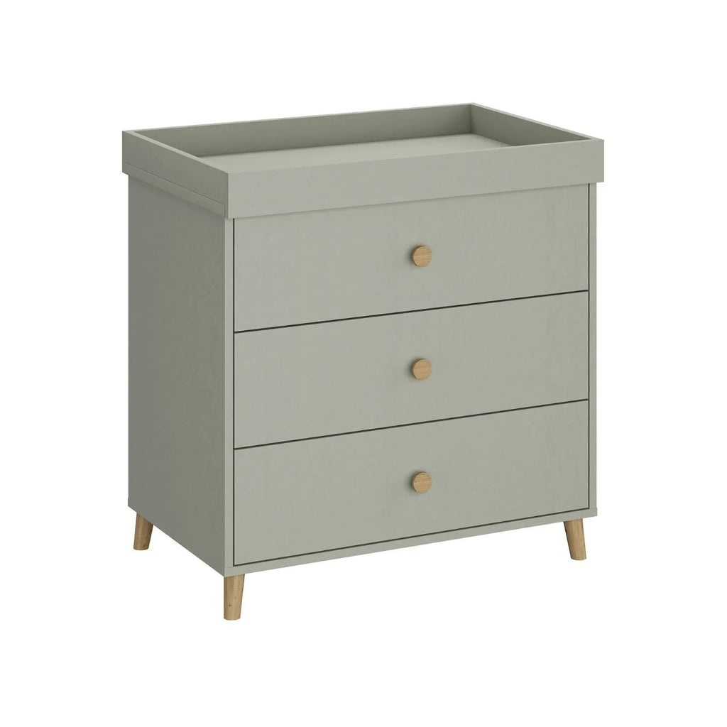Grey kids changing dresser with 3 drawers, round brass knobs, and raised wooden legs