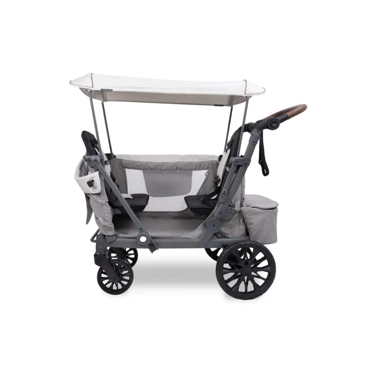 Grey stroller wagon, side view with canopy, 4 wheels and safety straps.