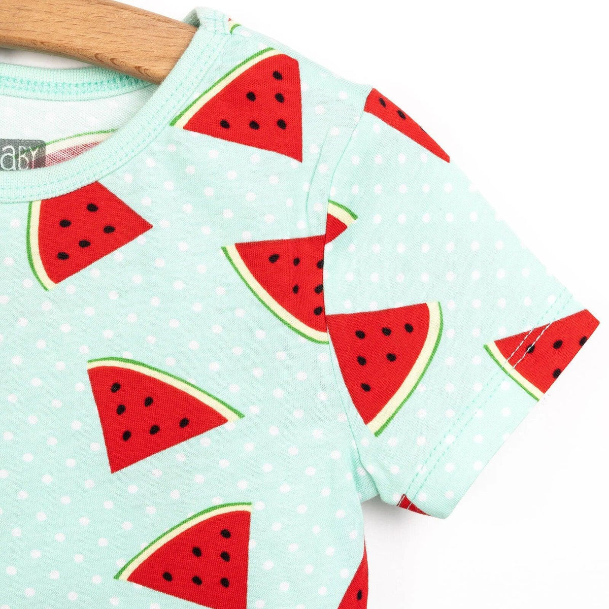 Mint pajama shoulder and sleeve with red watermelon slice print