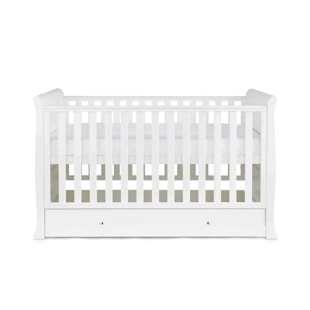 White wooden baby cot with vertical slats and drawer base, front view