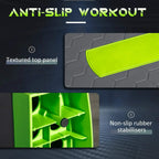 Grey and green aerobic step with textured top panel and non-slip rubber stabilizers.