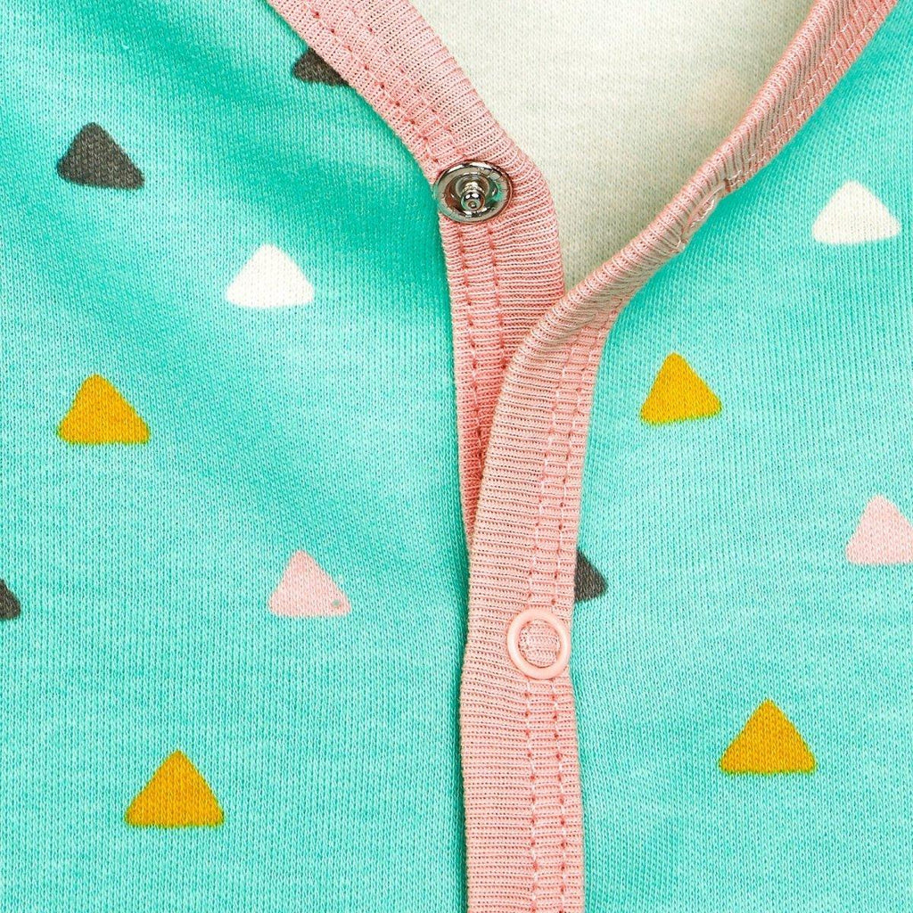 Mint pajama front close-up with pink trim snap buttons and triangle pattern.